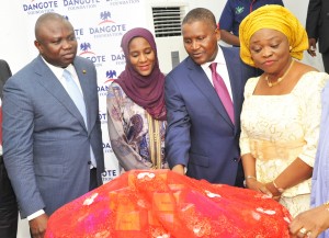 L-R: Executive Lagos State Governor, Mr. Akinwunmi Ambode; Executive Director, Dangote Group, Halima Aliko Dangote; President/CE, Dangote Group, Aliko Dangote; Lagos State Commissioner for Women Affairs and Poverty Alleviation, Mrs. Lola Akande; during The Official flag-off of the Dangote Foundation Micro Grant Scheme for Women in LGAS/LCDAS on Thursday, 26th May, 2016 in Lagos.
